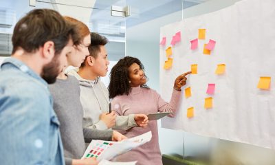 A startup team is brainstorming together to tackle common digital marketing mistakes and come up with smart solutions.
